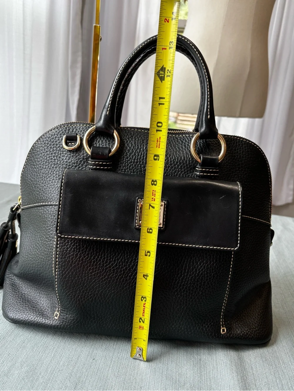 Dooney & Bourke Black Leather Satchel with Gold Hardware and Tassel